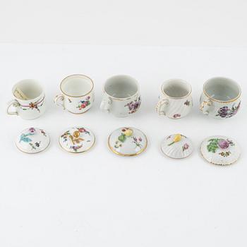 Two dinner plates and 11 custard cups with covers, 18th/20th Century.