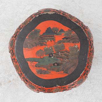 A Chinese red lacquer stool/table, 20th Century.