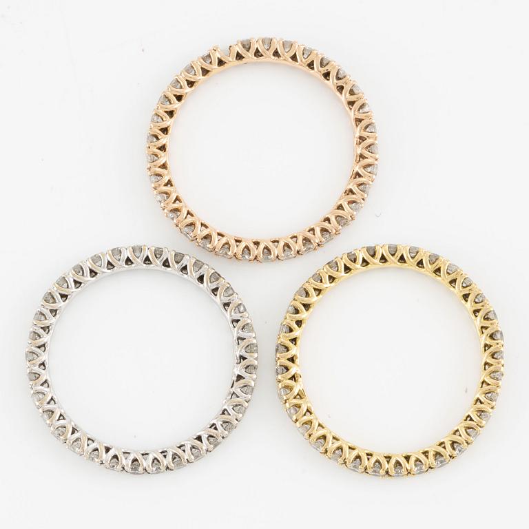 Rings, three pieces, set with brilliant-cut diamonds.