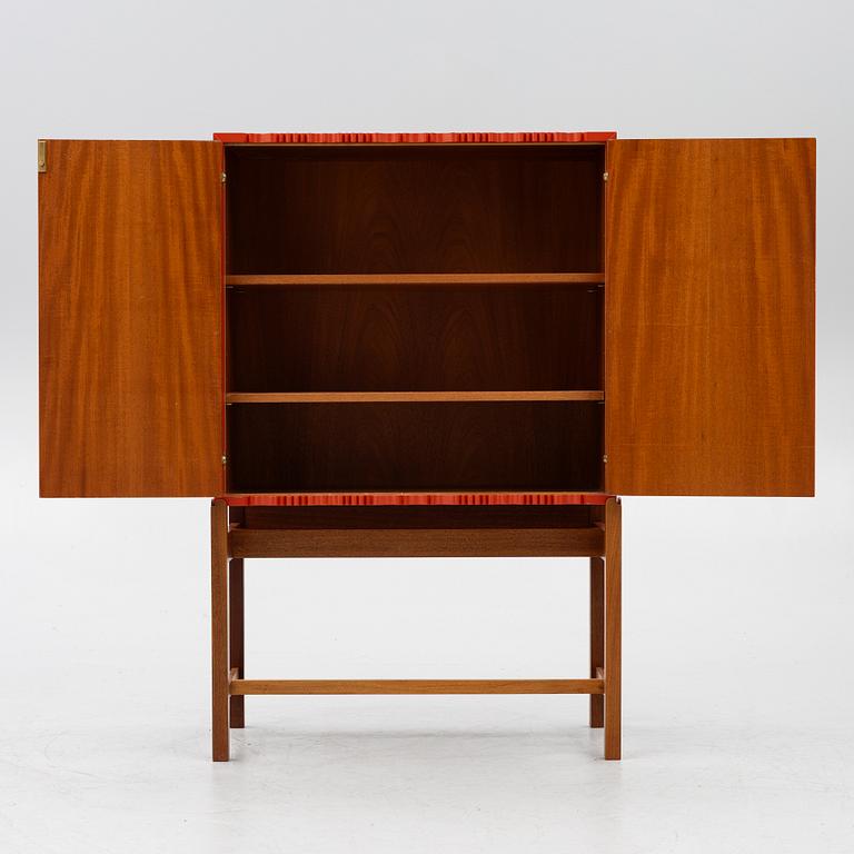 Josef Frank, a red lacquered cabinet, model 2192, 'The Cardboard Cabinet' by Svenskt Tenn, after 1985.