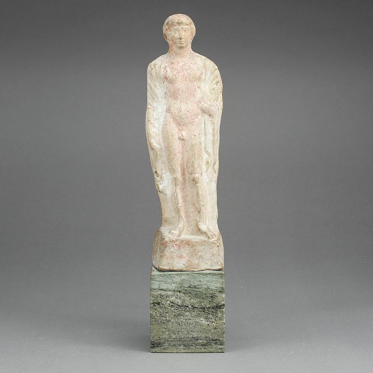 VOTIVFIGUR/KOUROS, terrakotta, möjligen Arkaisk tid 800-480 f.Kr.