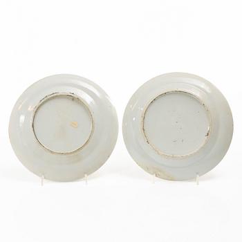 A matched set of 14 famille rose 'Canton' dinner plates, Qing dynasty, 19th century.