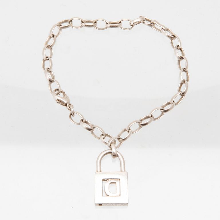 Tiffany & Co a silver pendant with accompanying bracelet.