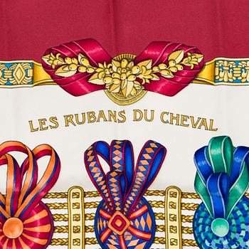 Hermès, a 'Les Rubans du Cheval' silk scarf.