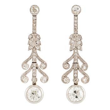 593. A pair of earrings in platinum and 18K gold set with old- and rose-cut diamonds.