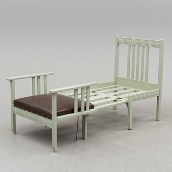 An early 20th century chair/children's bed.