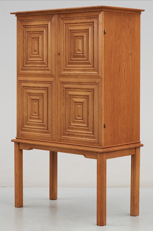An Oscar Nilsson oak cabinet, probably executed by cabinetmaker J Wickman, Stockholm 1940's.