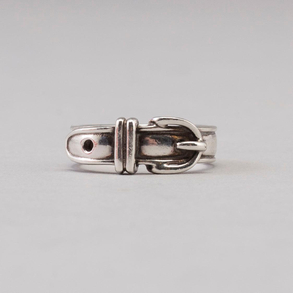 A silver ring by Hermès.
