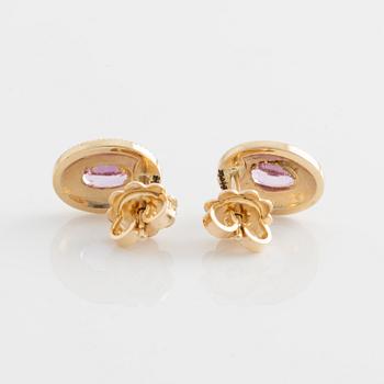 Earrings with pink sapphires and brilliant-cut diamonds.