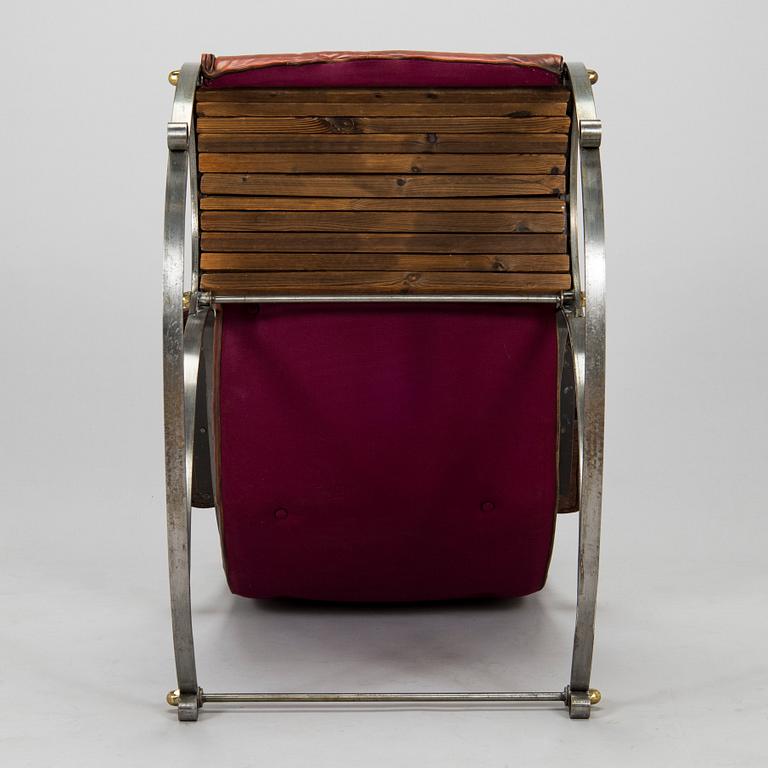 A 20th century steel frame rocking chair.