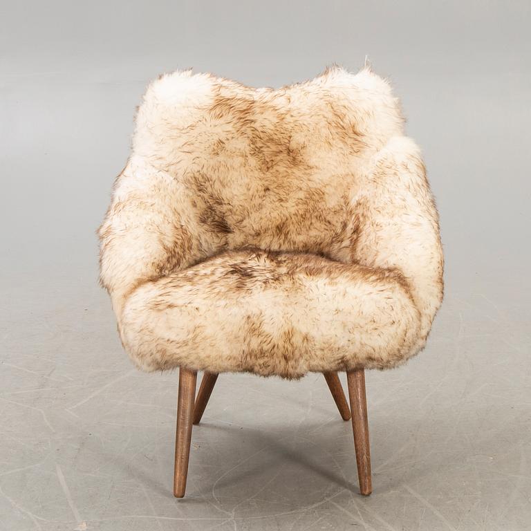 A 1950/60 sheepskin armchair.