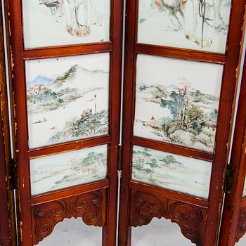 A Chinese folding screen with 48 porcelain tiles, late Qing dynasty, signed Ren Huanzhang, and dated 1881.