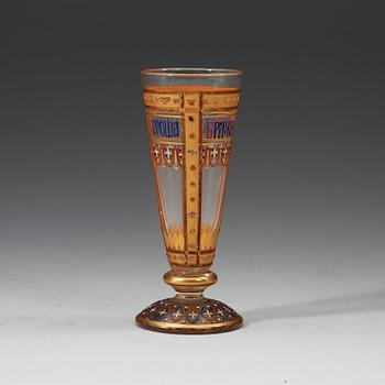 A small Russian vodka glass painted with enamel colours and gold, late 19th Century.