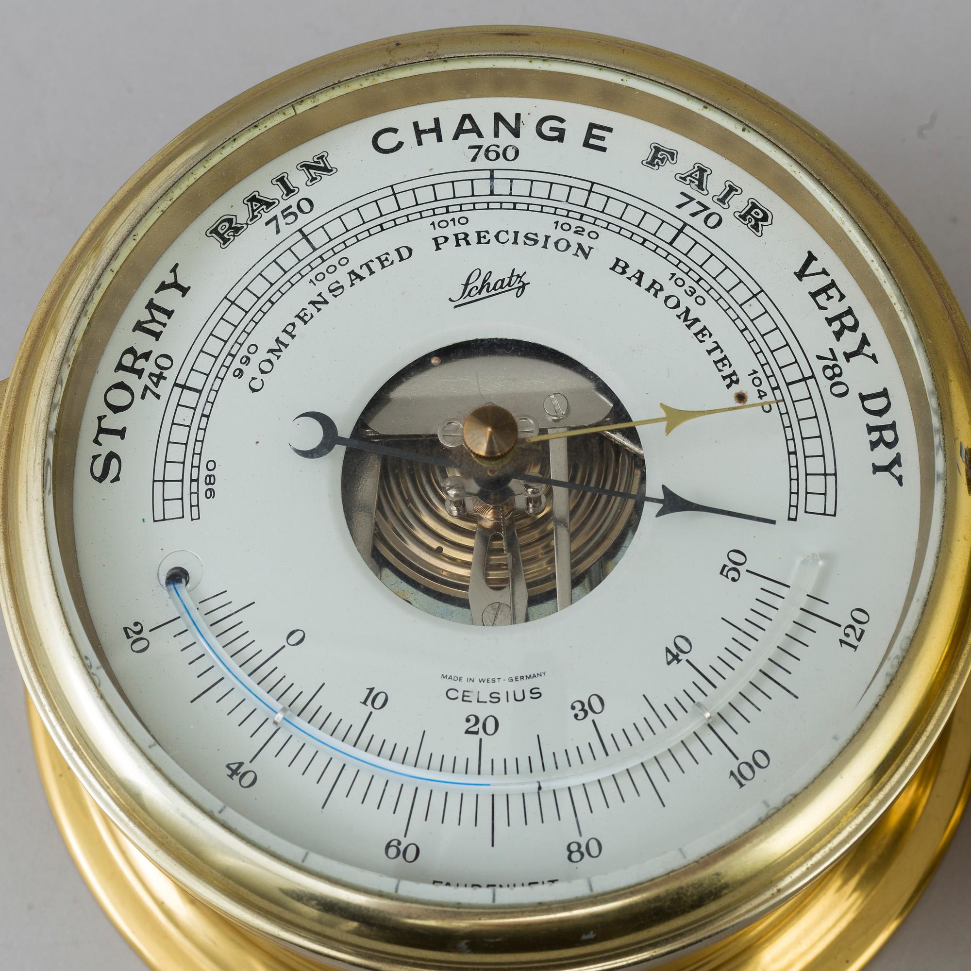 A ships barometer and clock, Schatz, 20th century.