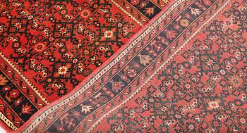 A Hosseinabad runner, c. 384 x 80 cm.