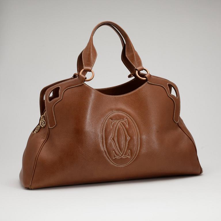 CARTIER, a brown leather bag.