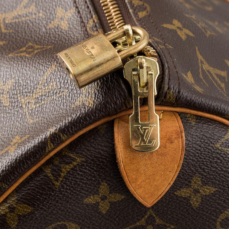 Louis Vuitton, a monogram canvas 'Keepall 55' weekend bag and toilet bag.