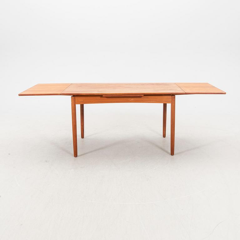 A 1960s teak dining table.