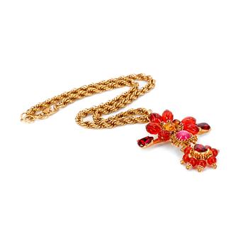 449. CHRISTIAN LACROIX, a gold colored necklace with flower shaped pendent.