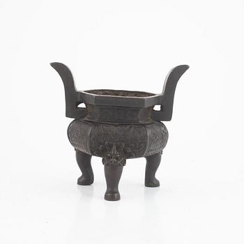 A Chinese bronze tripod censer, Ming dynasty (1368-1643).