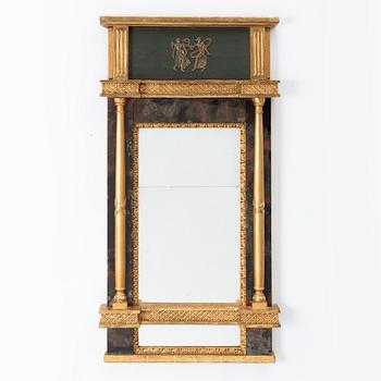 An Empire mirror, first half of the 19th century.