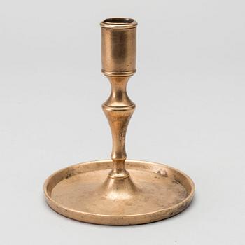 A BRASS CANDLE STICK.