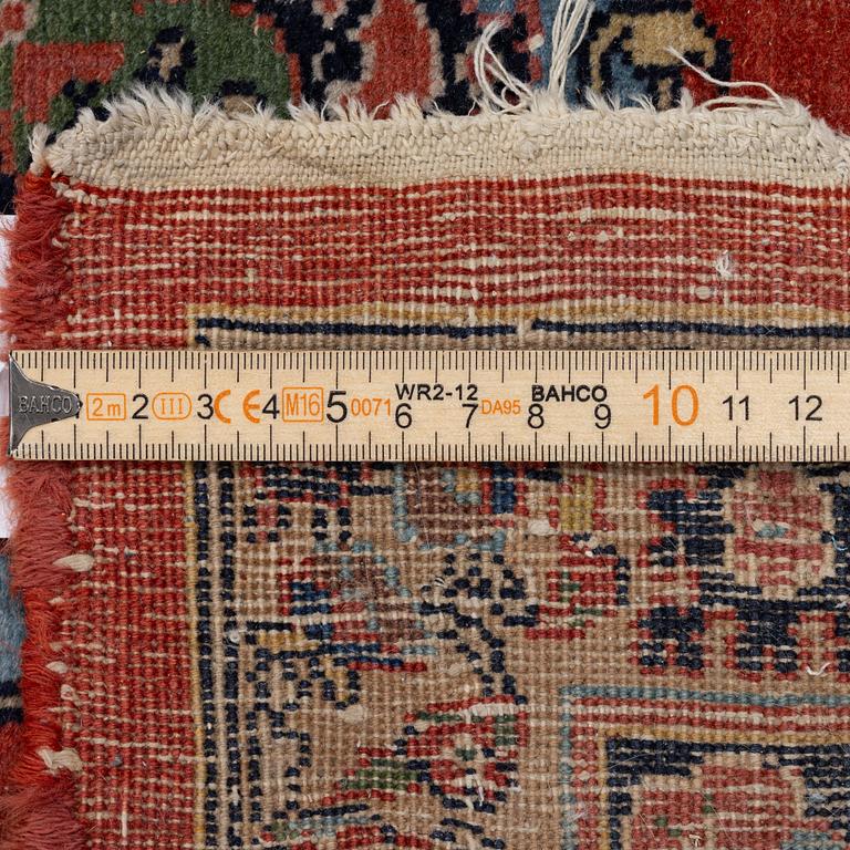 An oriental carpet, c. 370 x 275 cm.