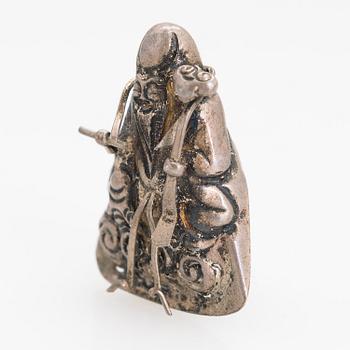 A silver figurine. China early 20th century.