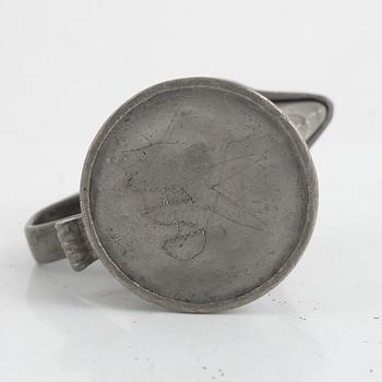 A pewter measuring cup by an unidentified master, dated 1766.