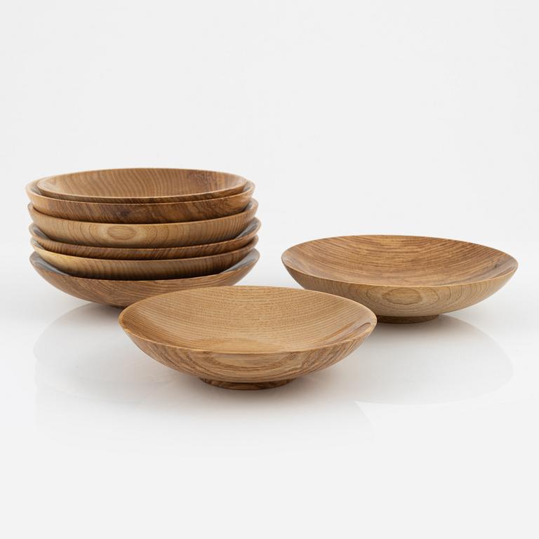 Magnus Ek, a set of eight ash wood plates for Oaxen Krog, 2021.