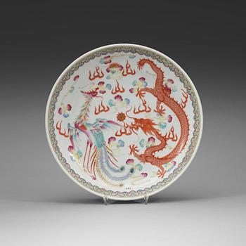 370. A phoenix and dragon famille rose dish, Qing dynasty, with Guangxu six character mark and period (1875-1908).