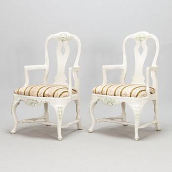 A pair of Rococo style armchairs, a pair of chairs, and a table, mid 20th century.