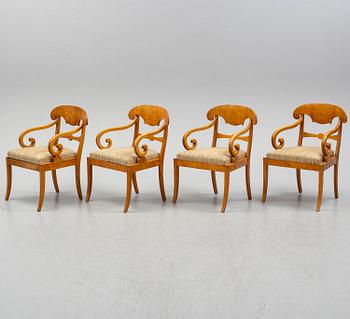 A Biedermeier table and four armchairs, mid 19th century.