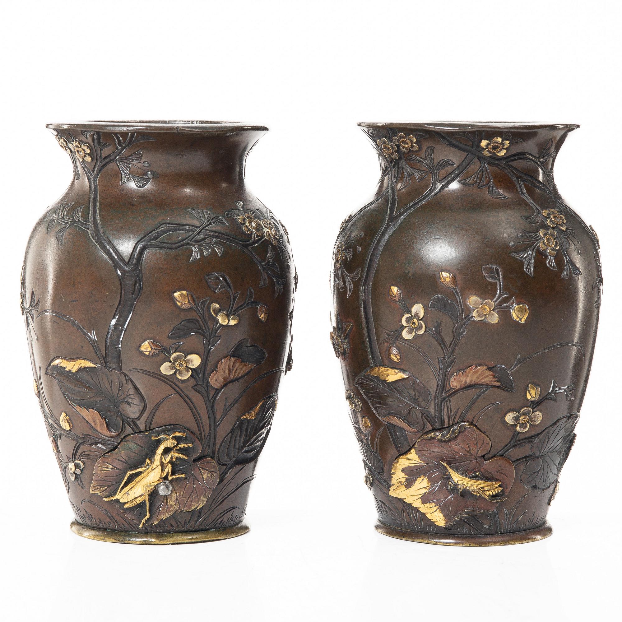 A pair of Japanese metal vases, Meiji (1868-1912).