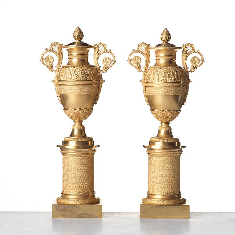 A pair of French Empire candlesticks, early 19th century.