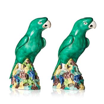 A pair of green glazed parrots, late Qing dynasty.