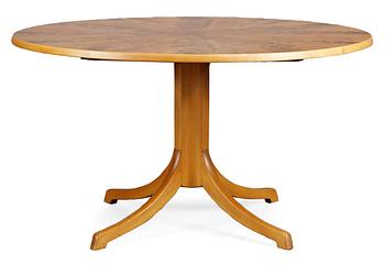 630. A Carl Malmsten mahogany and walnut dinner table, 1940's-50's.