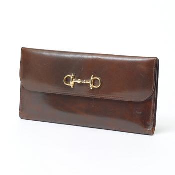 512. An darkbrown leather evening bag/wallet by Celine.
