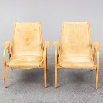 A pair of Laminett Yngve Ekström chairs.