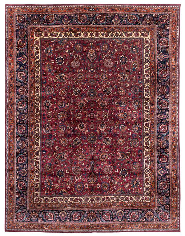 A Mashad carpet, signed Saber, c. 459 x 348 cm.