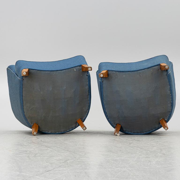 A pair of 1950's armchairs.