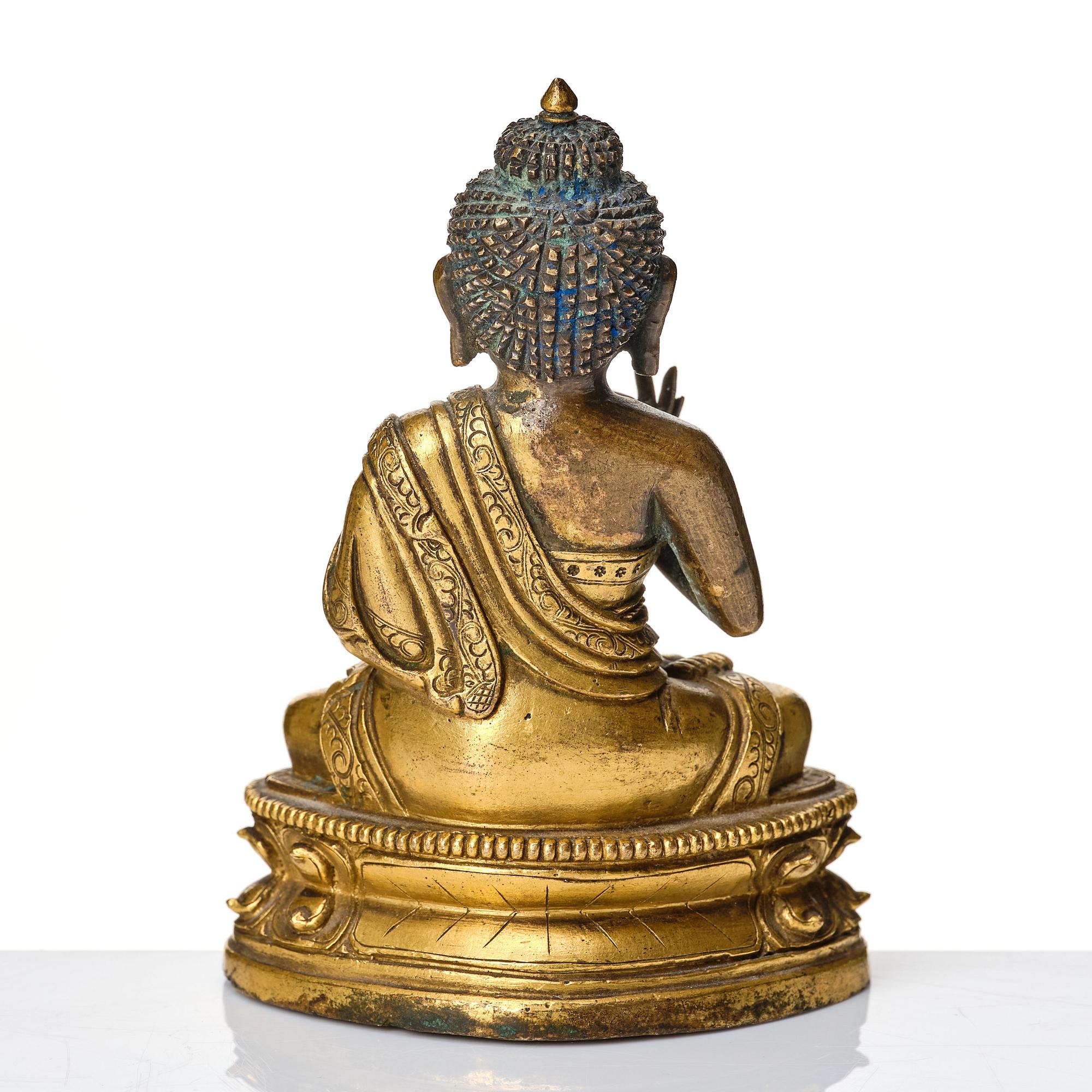 A partly gilt Tibeto-Chinese figure of Maitreya Buddha, 17th century.
