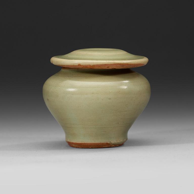 A celadon miniature jar with cover, Ming Dynasty (1368-1644).