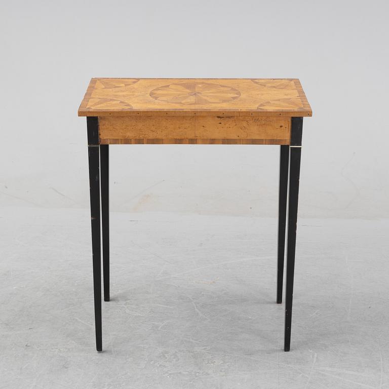 An inlay table, 19th Century.