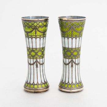 A pair of bud vases in parcel-gilt silver and guilloche enamel, early 20th century.