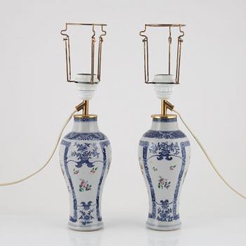 A pair of Chinese porcelain table lights/vases, 18th Century.