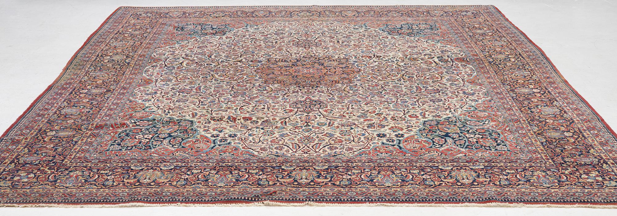 An antique Kashan Dabir carpet, c. 404 x 312 cm.
