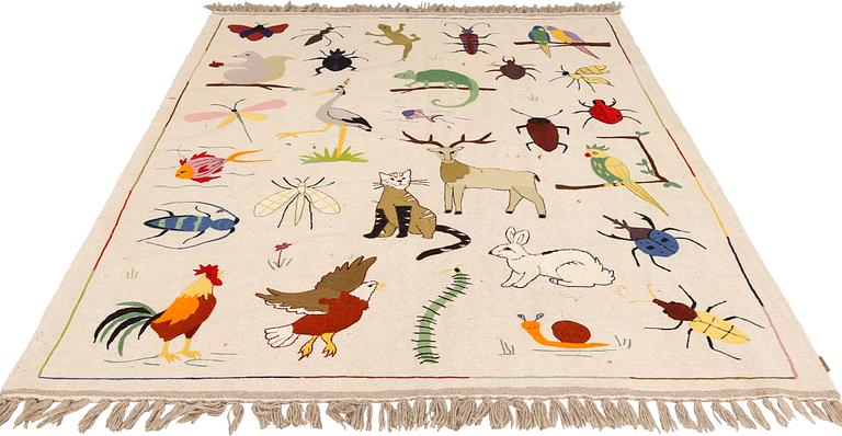 An embroidered flat weave rug, approx. 230 x 177 cm.