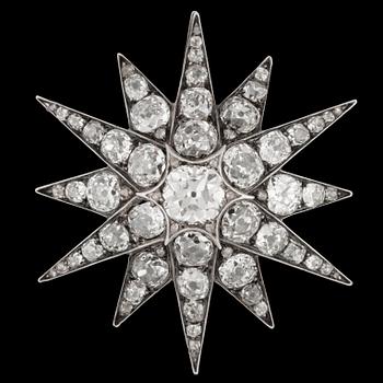 1107. An antique cut diamond star brooch, c. 1880.
