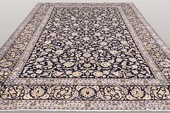 A carpet, Kashan, signed, ca 410 x 292 cm.